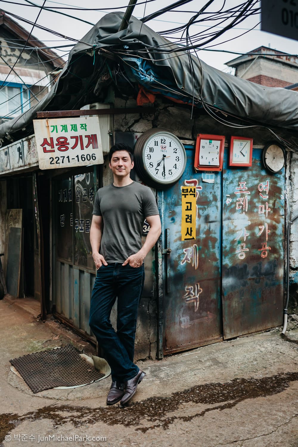 Seoul photographer Jun Michael Park made this environmental portrait of Daniel Tandler, a Korean-German architect specializing in Hanok, against a run-down metal workshop in Euljiro.