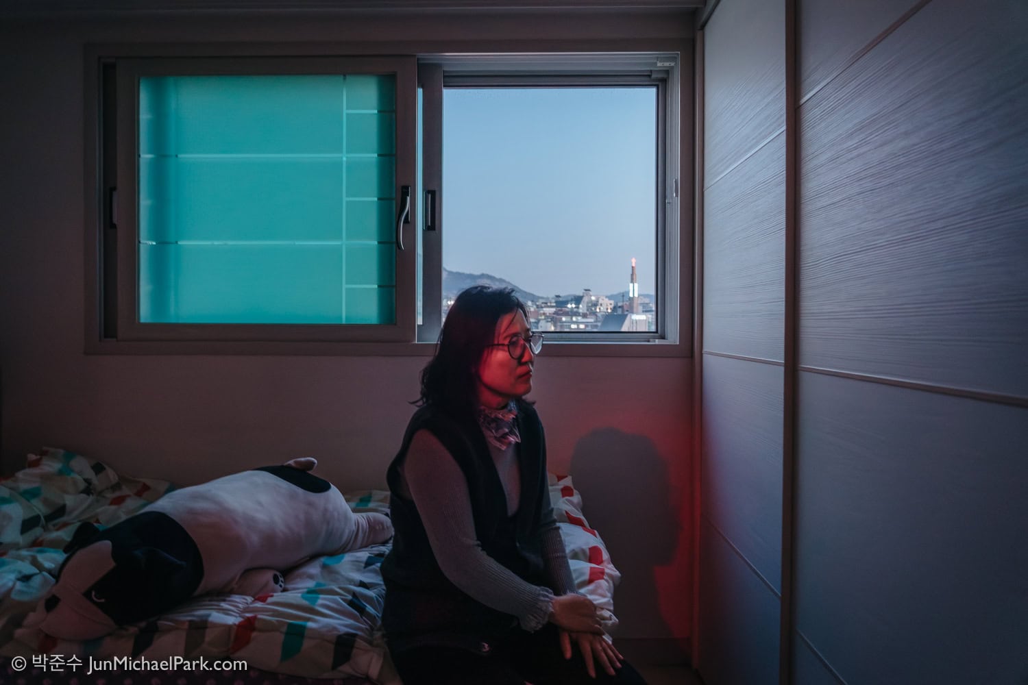 North Korean defector Kim Ryon-hui is directed to look to the right of the frame by Seoul photographer Jun Michael Park in a portrait setting at her home in Seoul.