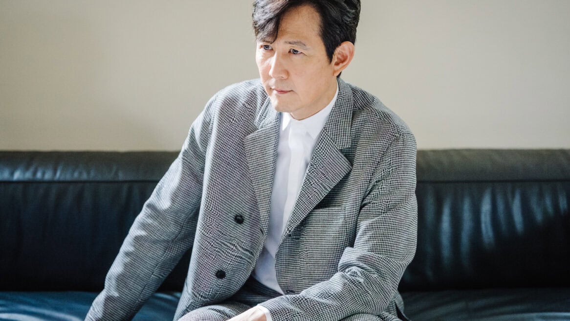 South Korean actor and Squid Game star Lee Jung-jae is directed to look to his right by Seoul photographer Jun Michael Park in a portrait setting.